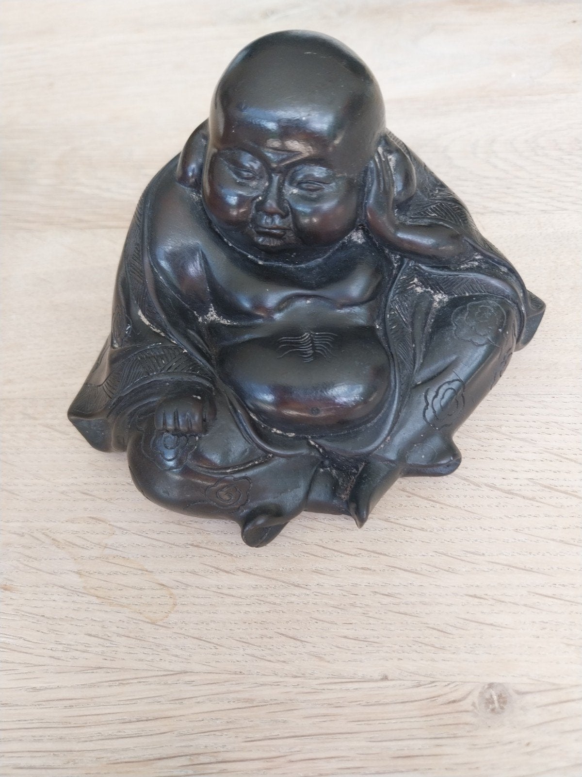 Boeddha met erotische onderkant, Ophalen