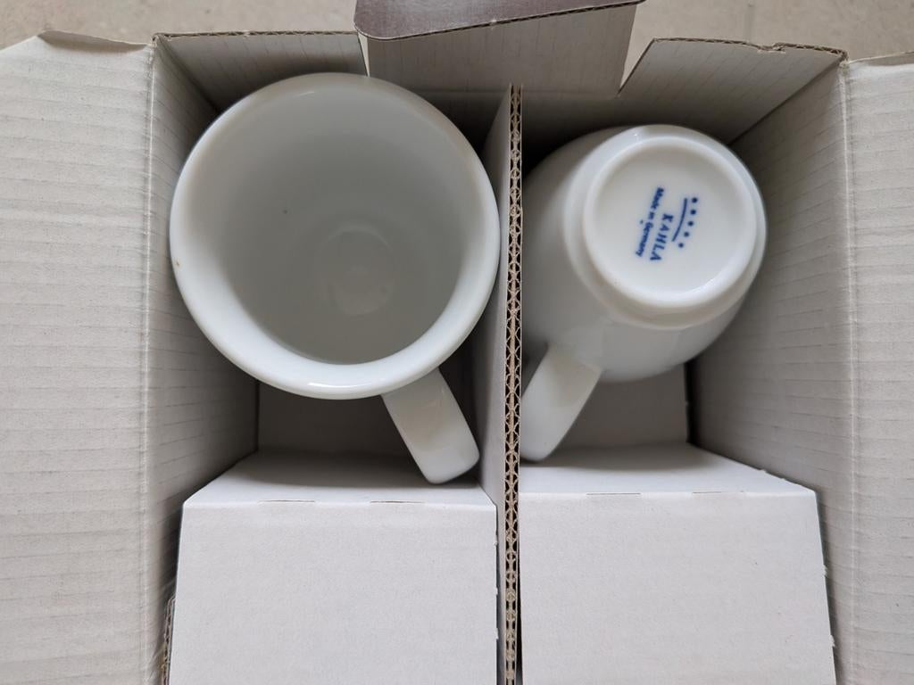 Nieuwe espressotassen met onderbord, Ophalen