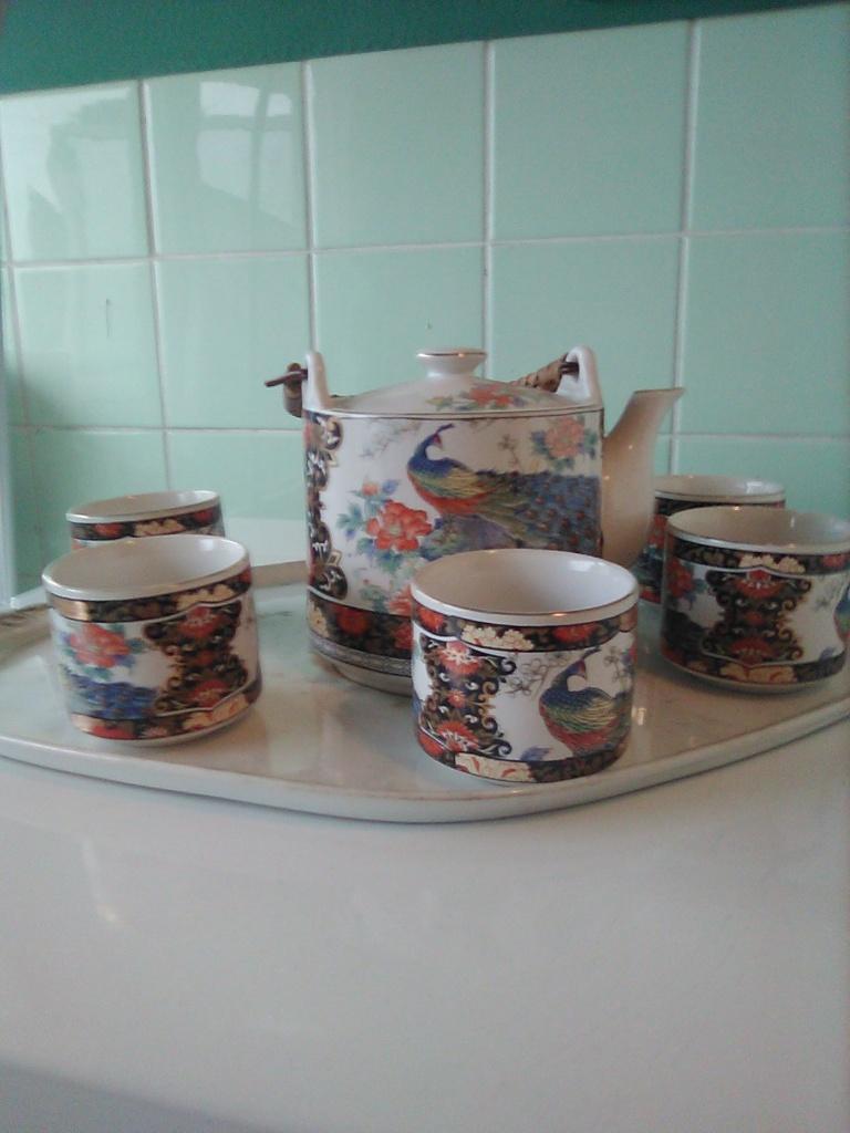 Royal Peacock Thee Servies AFHALING LEES BESCHRIJVING, Huis en Inrichting, Ophalen, Zo goed als nieuw, Overige stijlen, Porselein