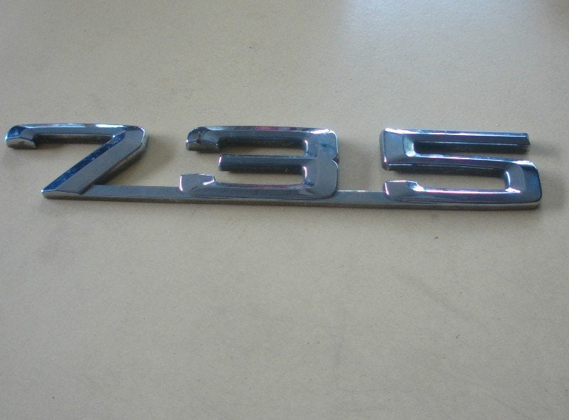 EMBLEEM BMW 7 serie (E38) (01-1994/11-2001), Gebruikt, BMW, Petuelring 130
80809  München, DE, Bayerische Motoren Werke AG