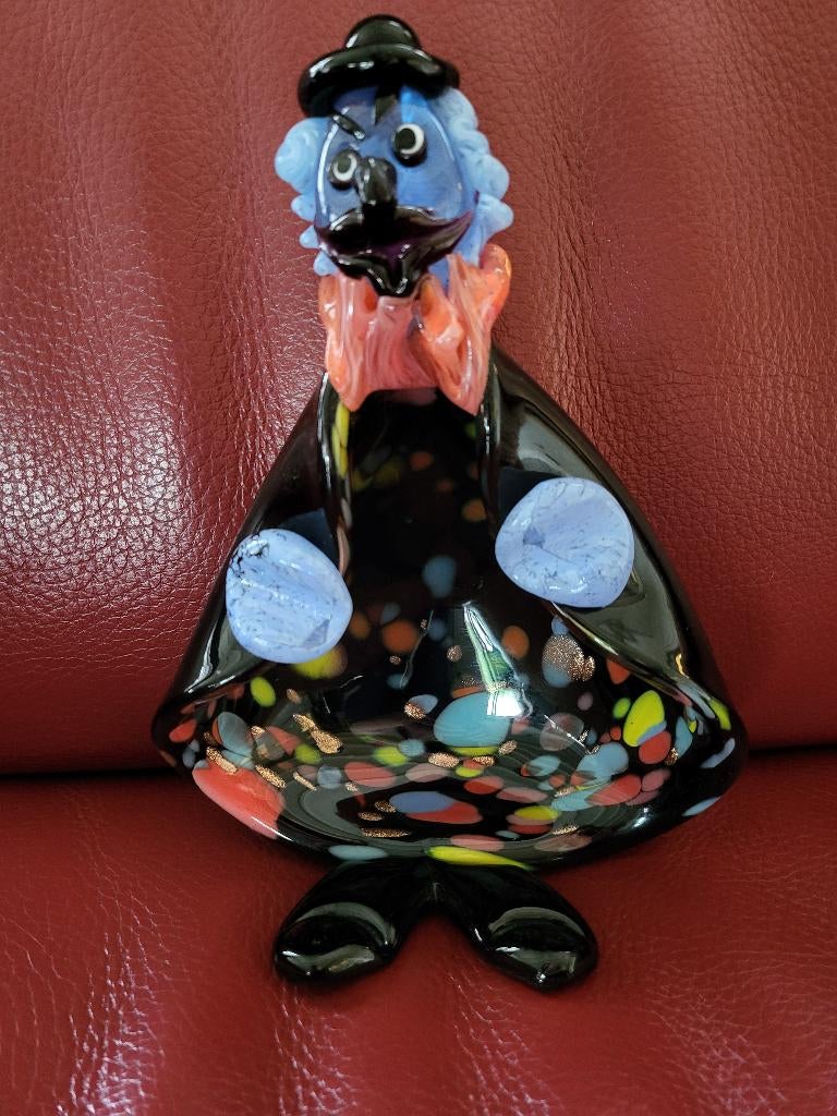 Murano glazen clown, Ophalen