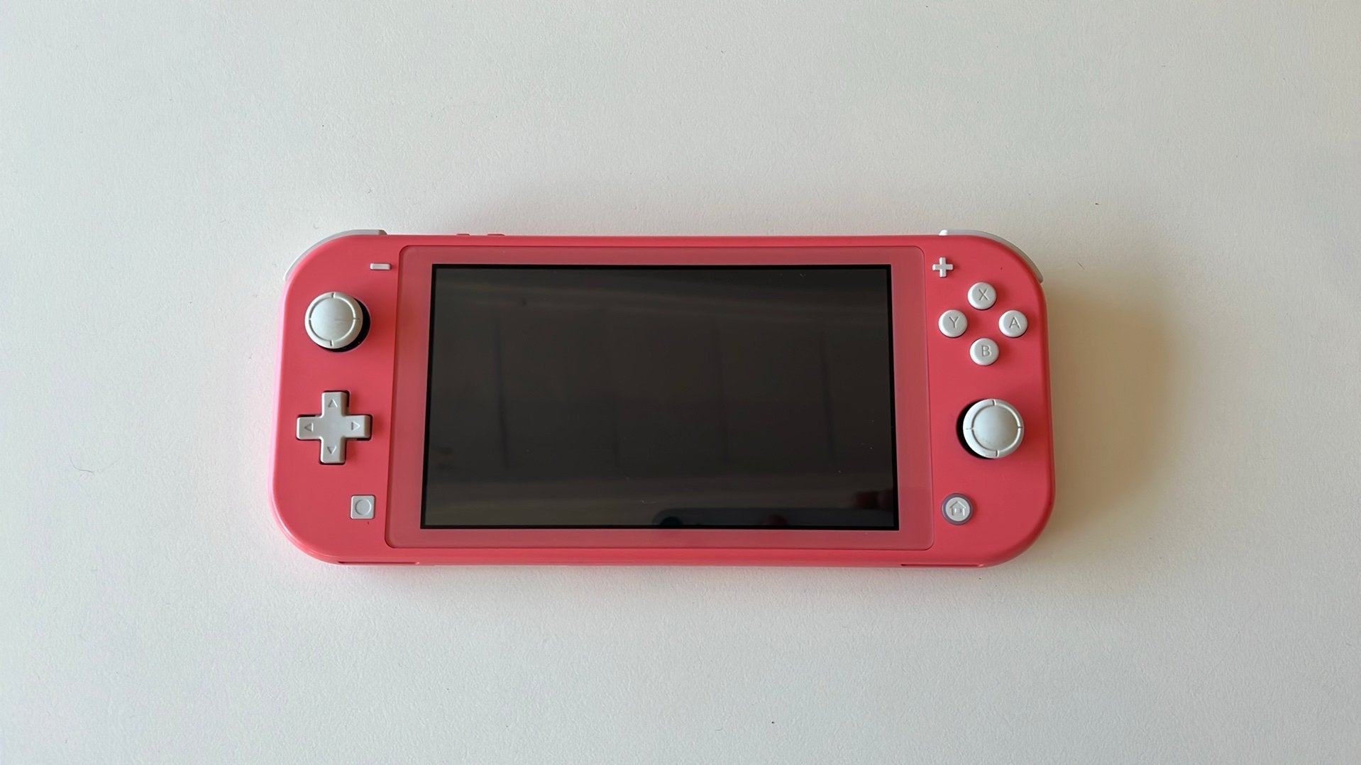 Nintendo switch lite + spelletjes, Enlèvement ou Envoi, Rose ou Corail, Comme neuf, Avec housse de protection ou sac