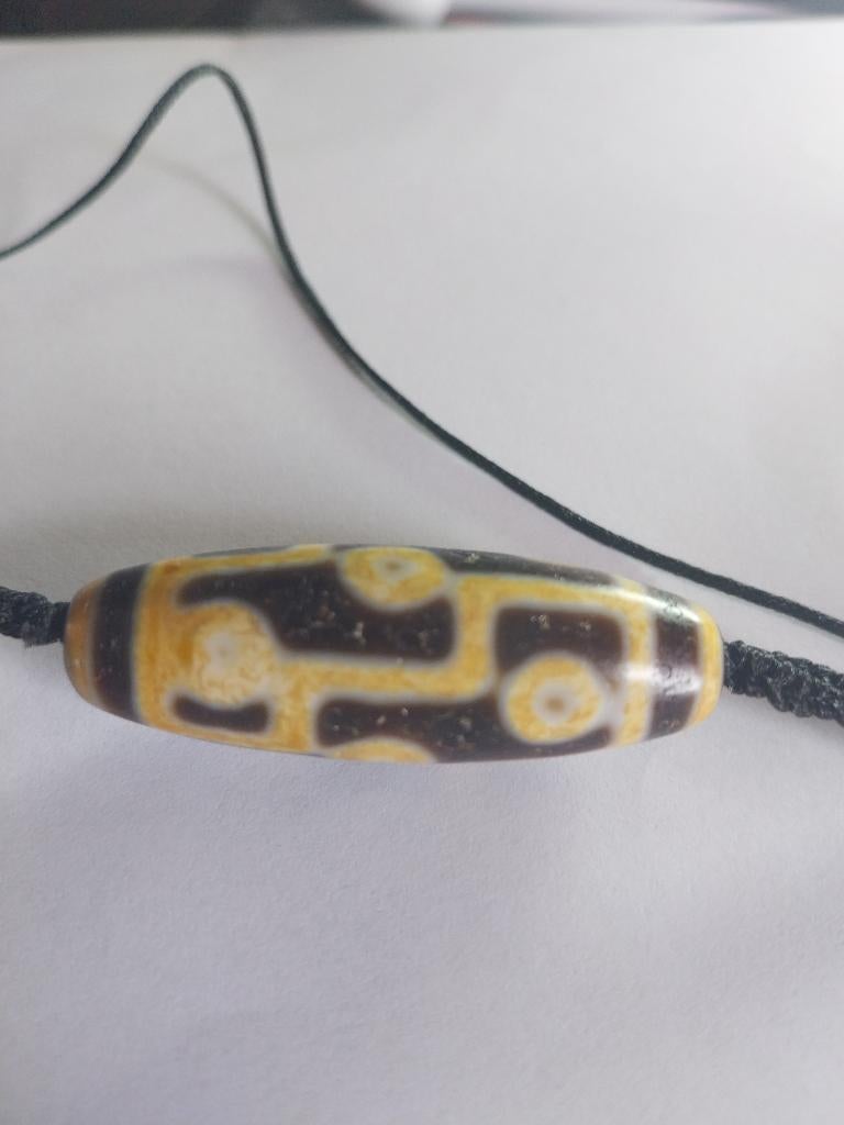 VINTAGE  PAREL DZI.HEILIG TIBETAANS AMULET MET 9 OGEN, Handtassen en Accessoires, Kettinghangers, Gebruikt, Overige materialen