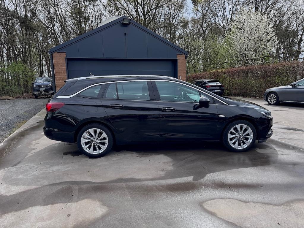 Opel Astra Sports Tourer 1.4 Turbo Innovation Automaat, Auto's, Leder en Stof, Zwart, Opel certified used cars, Bedrijf