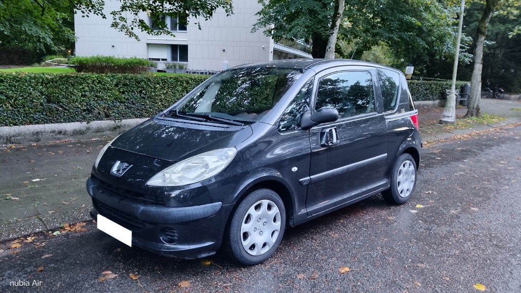2008 Peugeot 1007 1.4 diesel 88.000 km met keuring, Voorwielaandrijving, Stof, Zwart, Particulier
