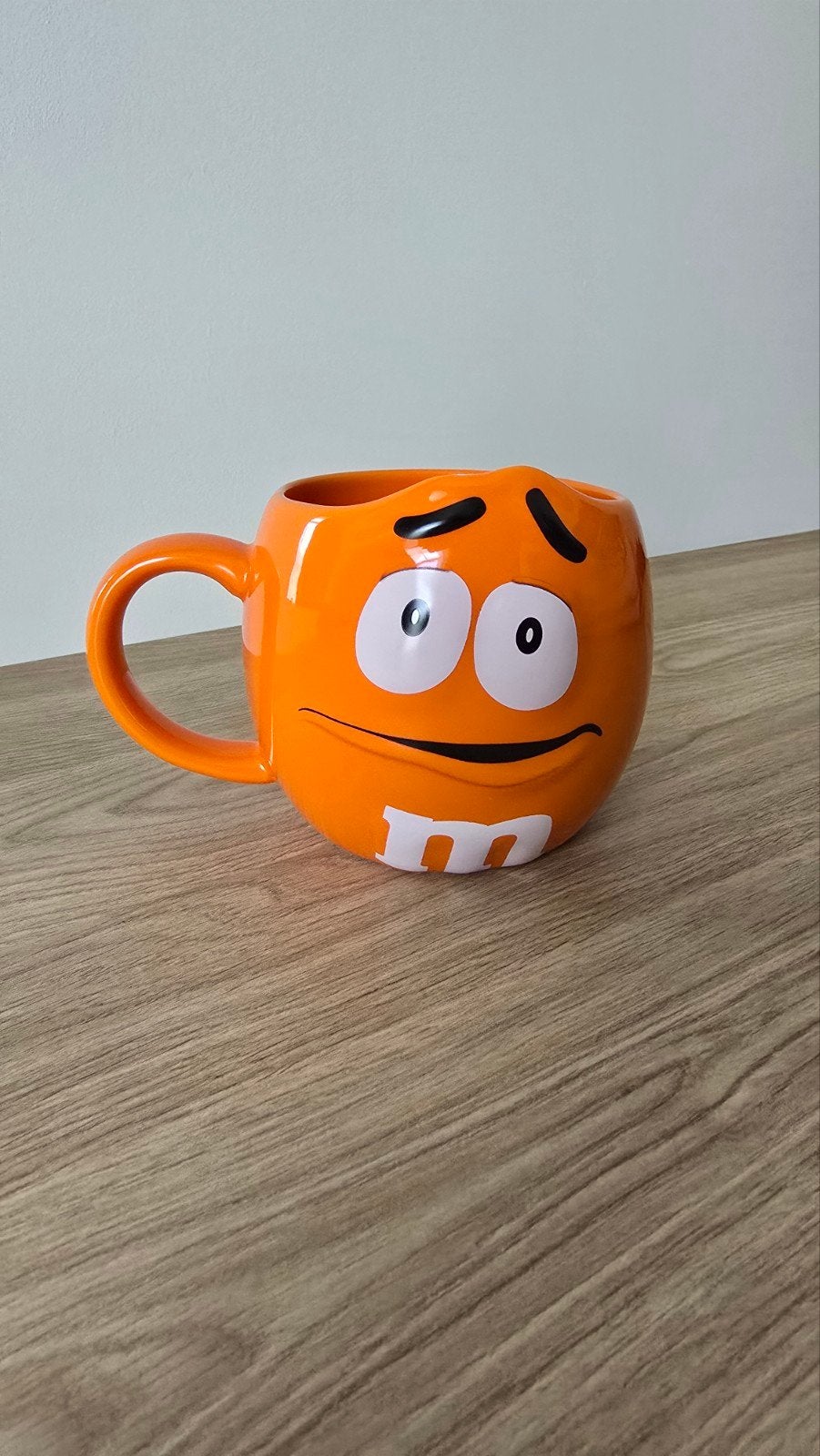 Verzamelmok van de oranje M&M (uit 2015) van Mars, Enlèvement ou Envoi