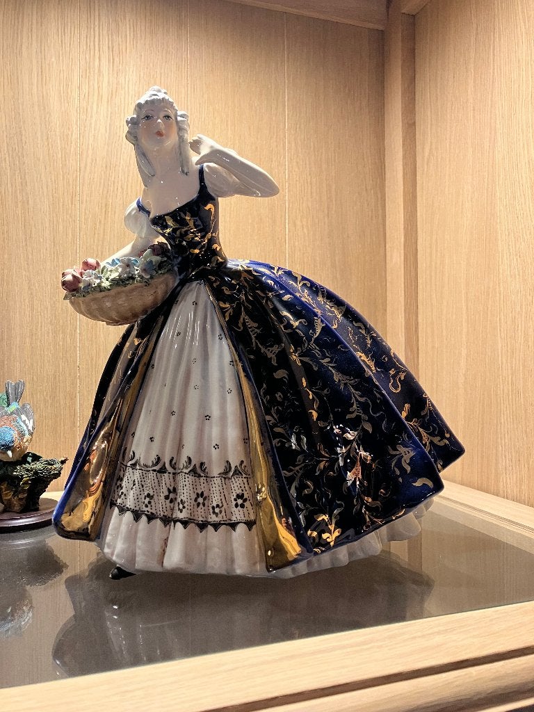Dame met bloemenmand, Ophalen