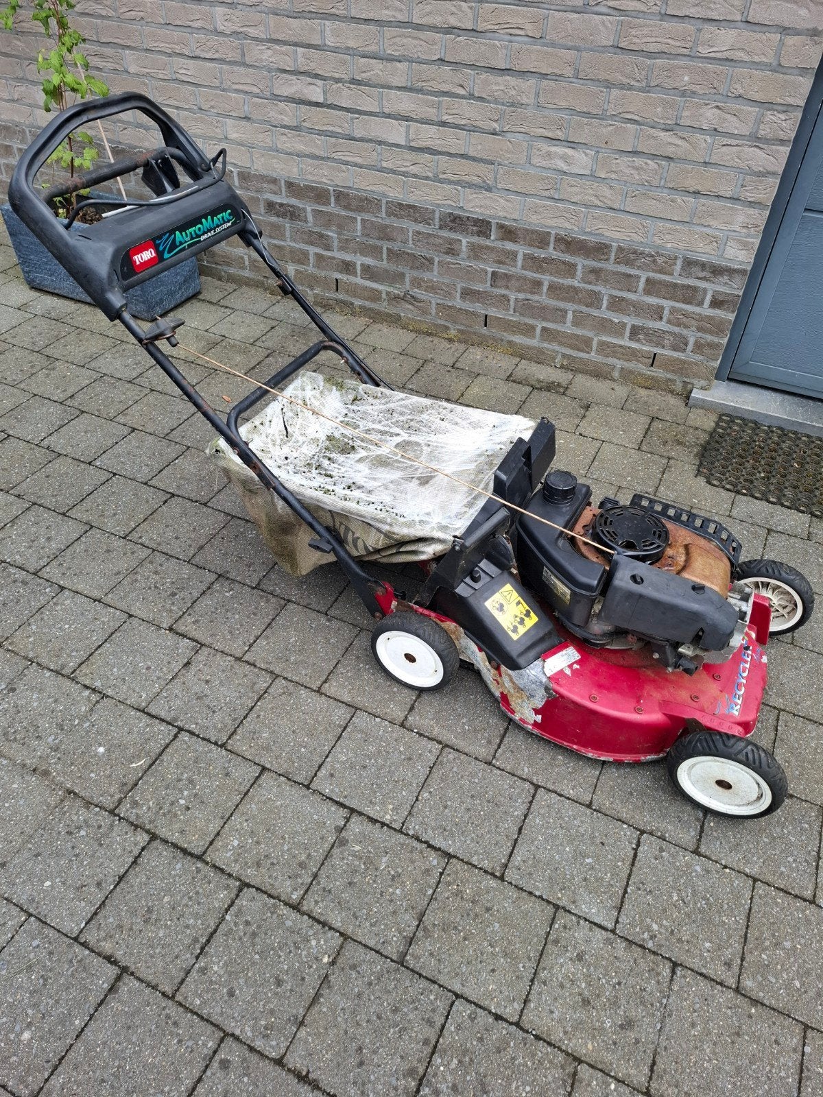 Opknapper Toro benzine grasmaaier zelftrekker, Enlèvement