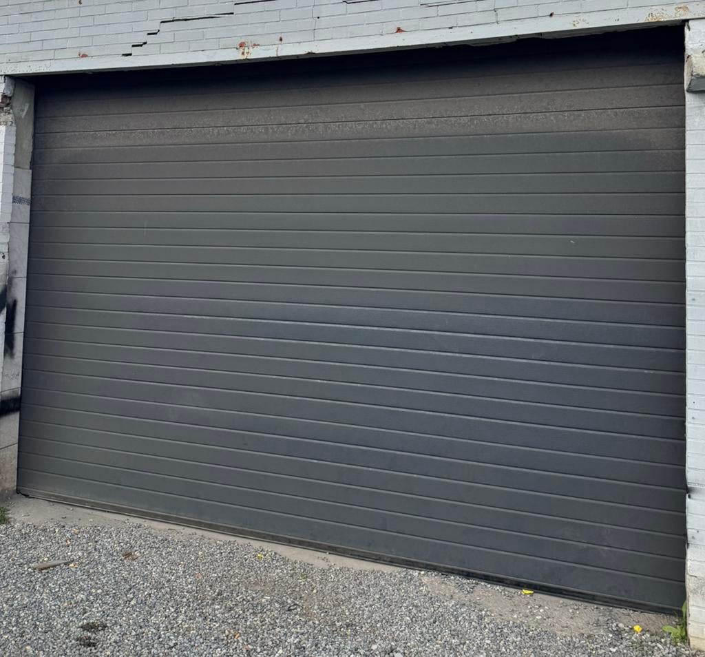 Elektrische sectionale poort + garagepoort