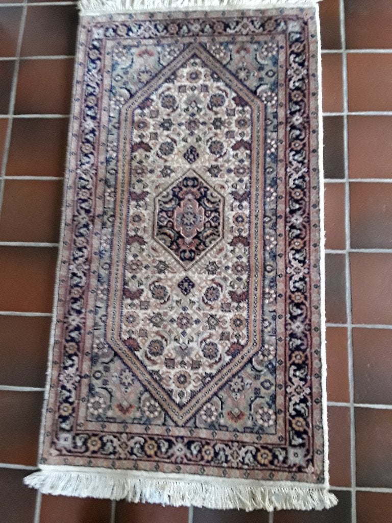 tapijt klein, Ophalen
