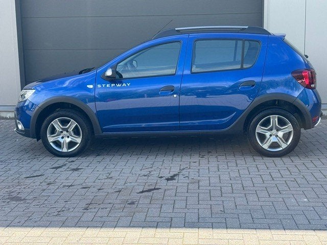 Dacia Sandero Stepway benzine 100pk, Auto's, Dacia, Voorwielaandrijving, 898 cc, Stof, Blauw