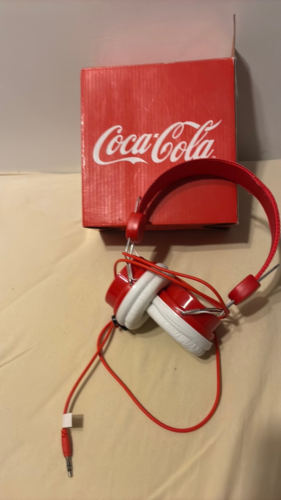 Koptelefoon coca cola new, Ophalen