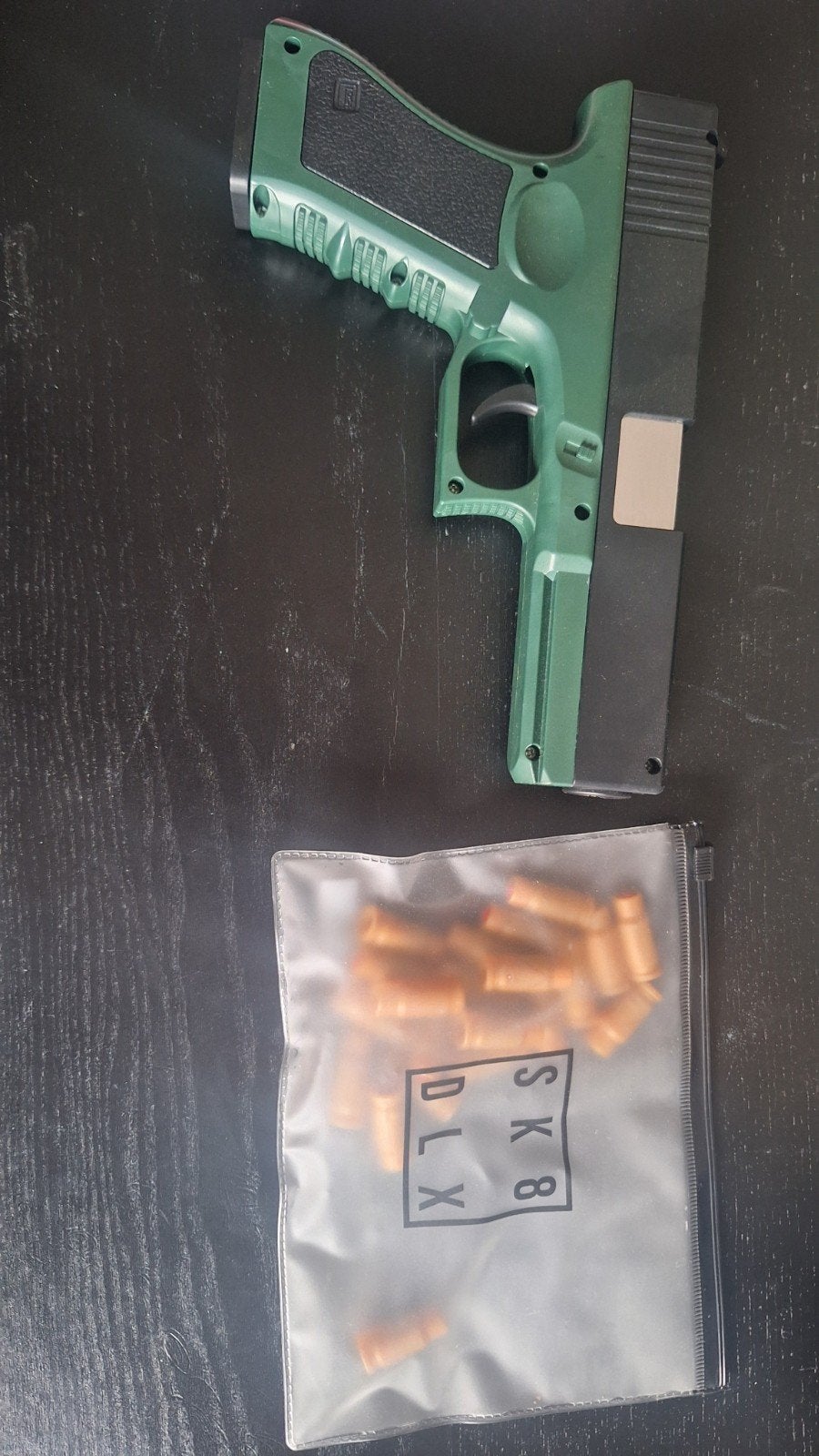 Speelgoed pistool met schuimkoggels, Ophalen