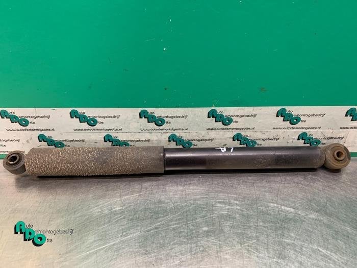 Schokdemper links-achter van een Daihatsu Cuore (Cuore 03-), Auto-onderdelen, Gebruikt, Daihatsu, -, -