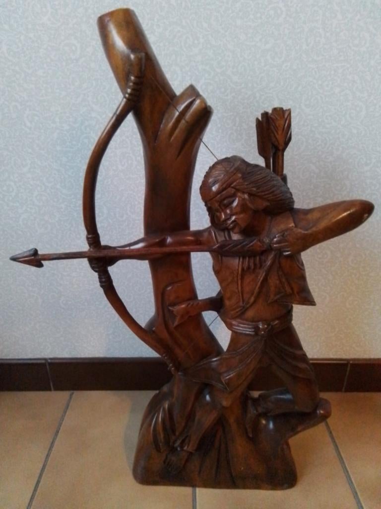 Indiaan in hout, Ophalen