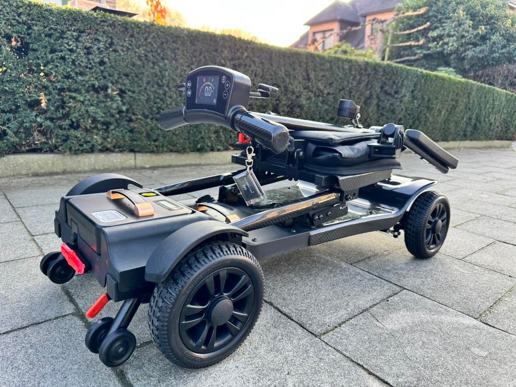 Opvouwbare Carbon Ultralichte 14kg Scootmobiel Nieuw scooter, Diversen, Rolstoelen, Ophalen of Verzenden, Inklapbaar, Zo goed als nieuw
