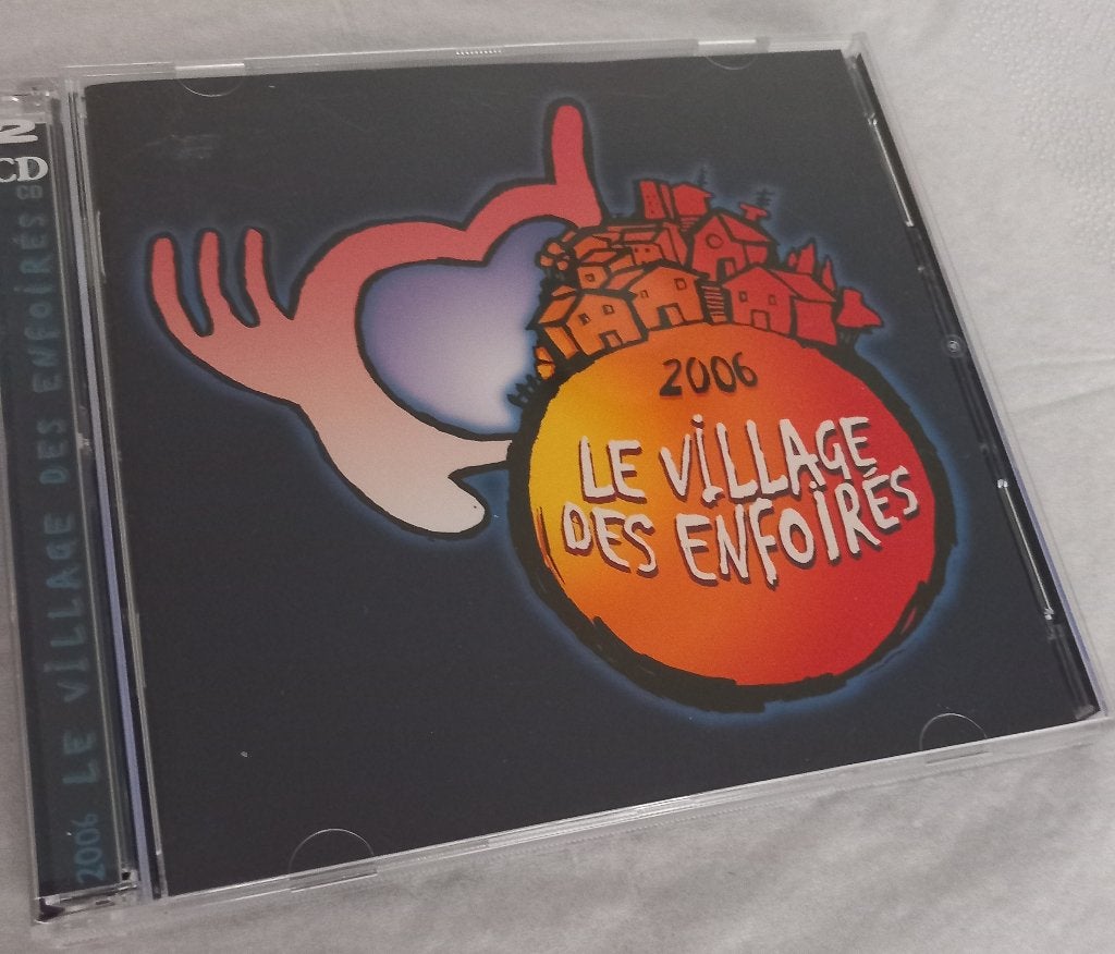 Le village des enfoirés (Live, 2 CDs) - 2006, Comprend un livret, Pop, Album live, Comme neuf