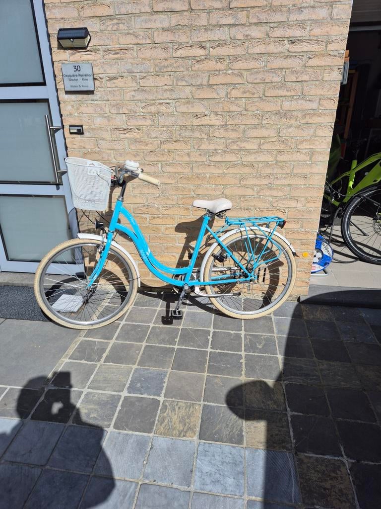 Meisjes fiets met mand, Ophalen