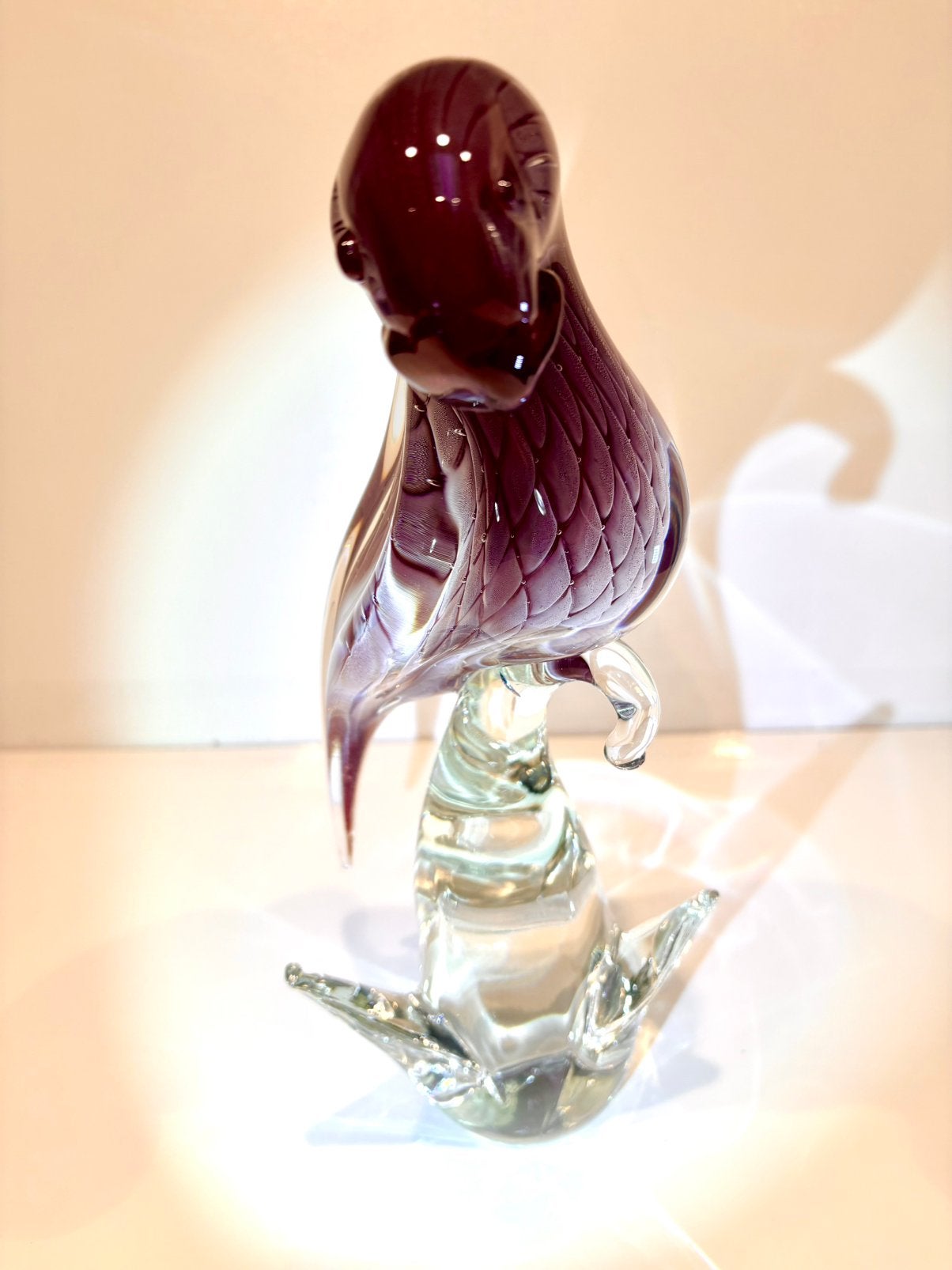 Perroquet en verre de Murano, Ophalen