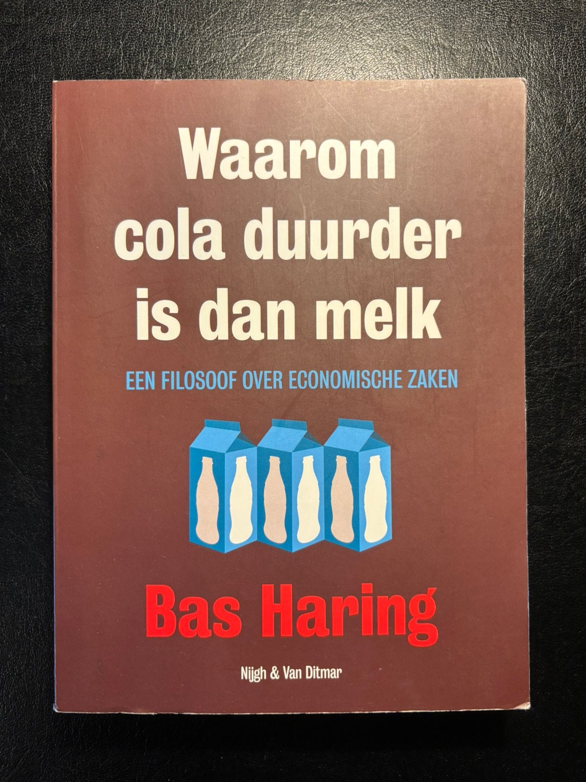 Boek: Waarom cola duurder is dan melk, Boeken, Ophalen, Zo goed als nieuw
