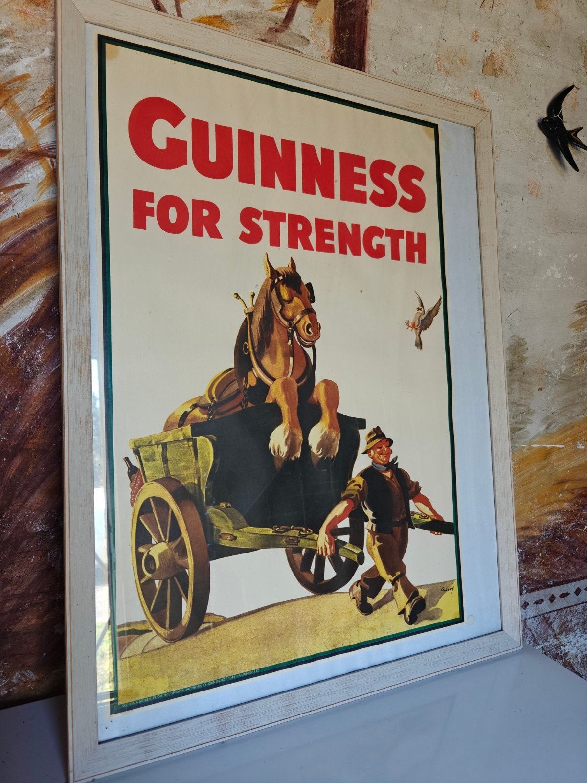 Guiness poster in kader, Ophalen