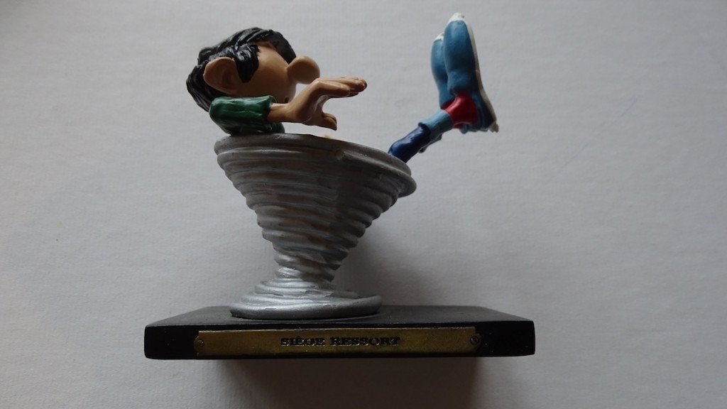 Figurine Gaston Lagaffe siège ressort, Collections, Personnages de BD, Enlèvement, Gaston ou Spirou, Utilisé, Statue ou Figurine