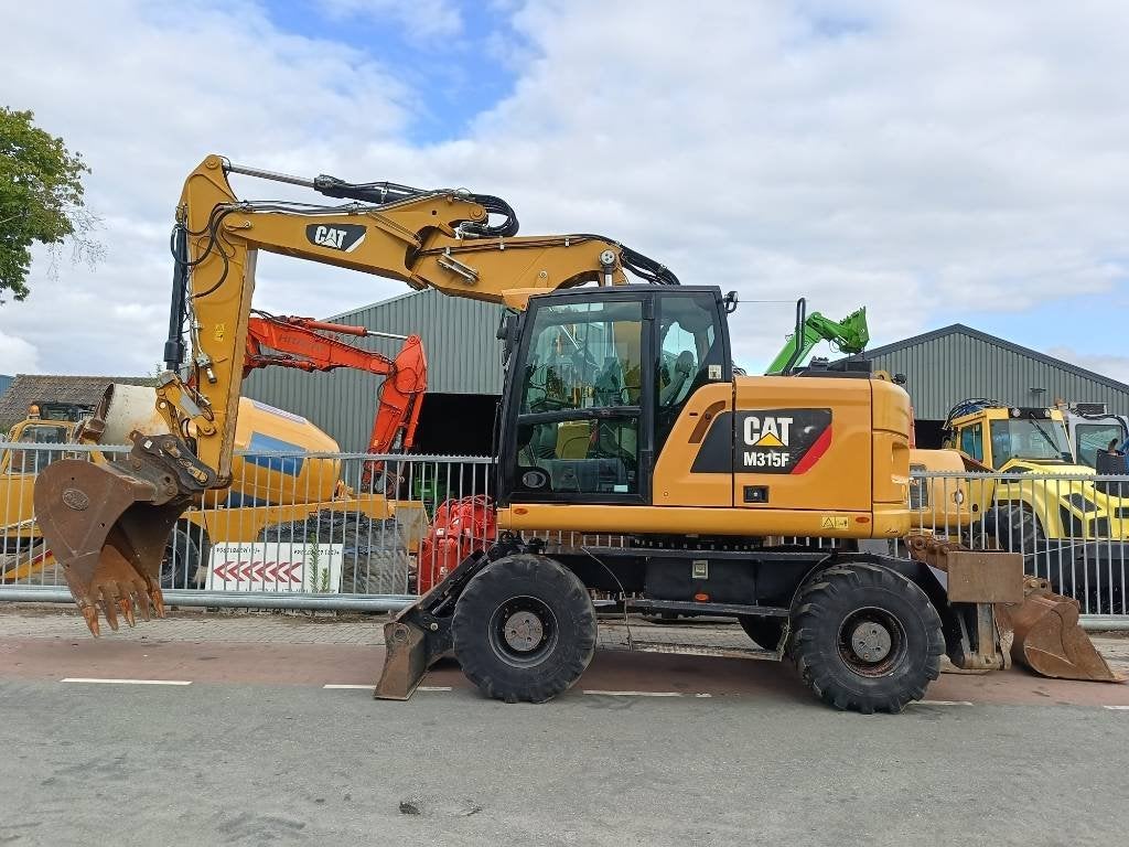 Cat M 315 F mobiele graafmachine excavator bagger, Excavatrice