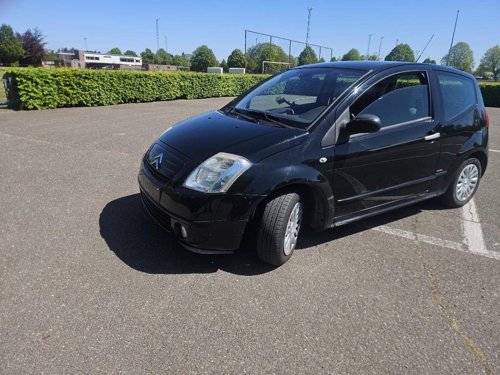 citroen c2-2005-1.1 benzine-reeds gekeurd-airco-, Auto's, 4 zetels, Stof, Airbags, Zwart