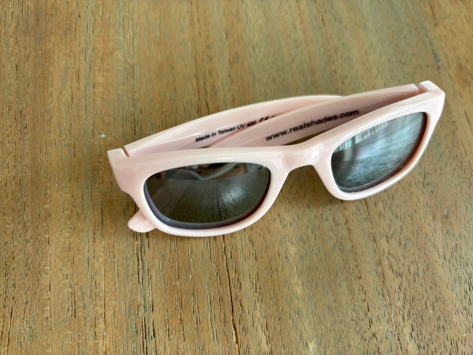 Realshades baby zonnebril roze, Ophalen, Zo goed als nieuw, Roze, Zonnebril