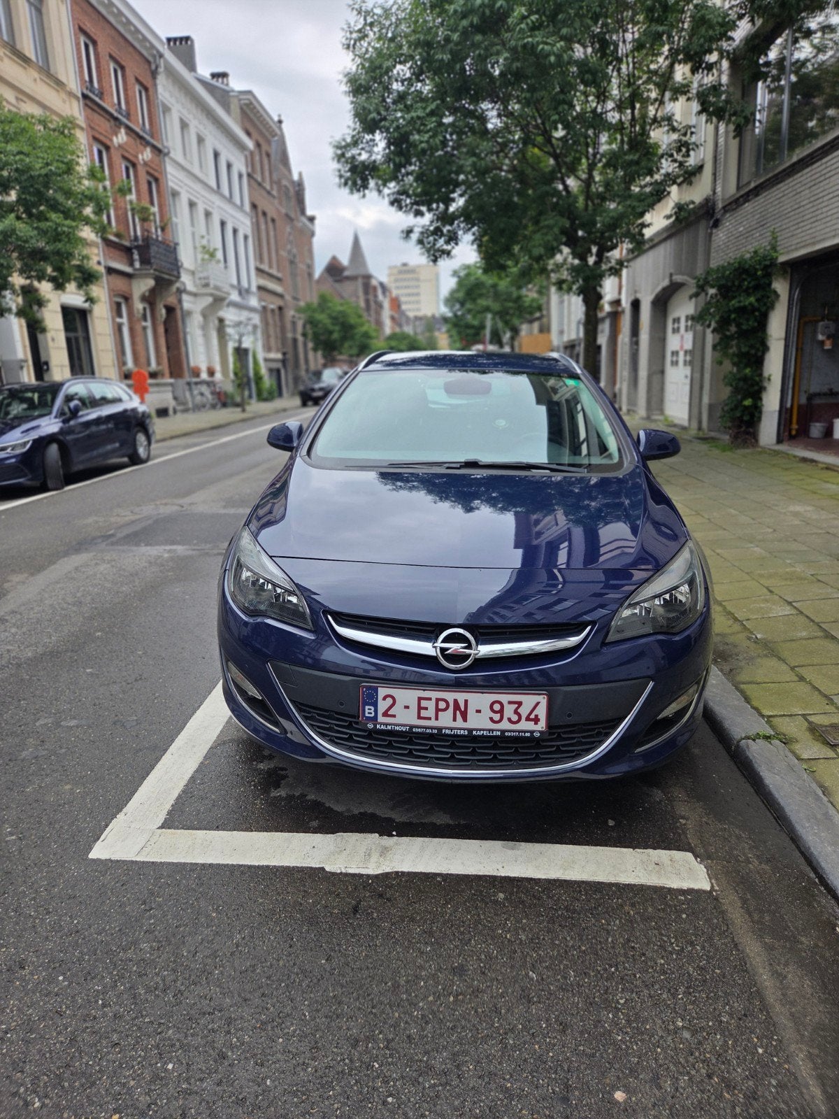 Opel Astra J 1.6 Sports Tourer Automat Benzine (2013), Zwart, 4 cilinders, Blauw, Navigatiesysteem
