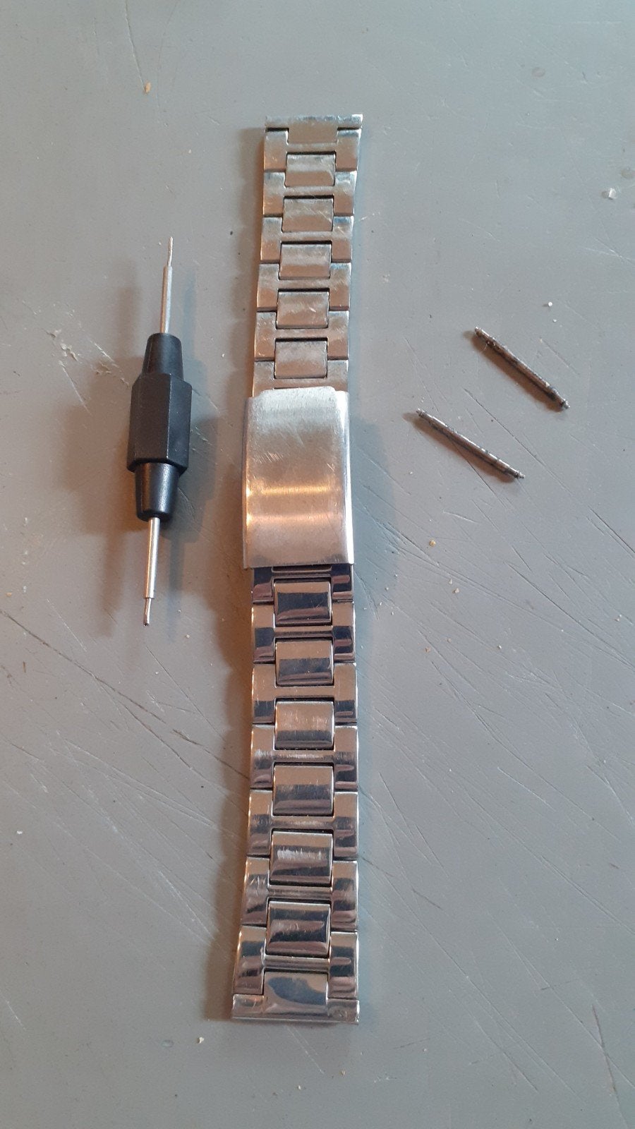 bracelet montre homme en métal, Handtassen en Accessoires, Ophalen of Verzenden, Gebruikt, Staal