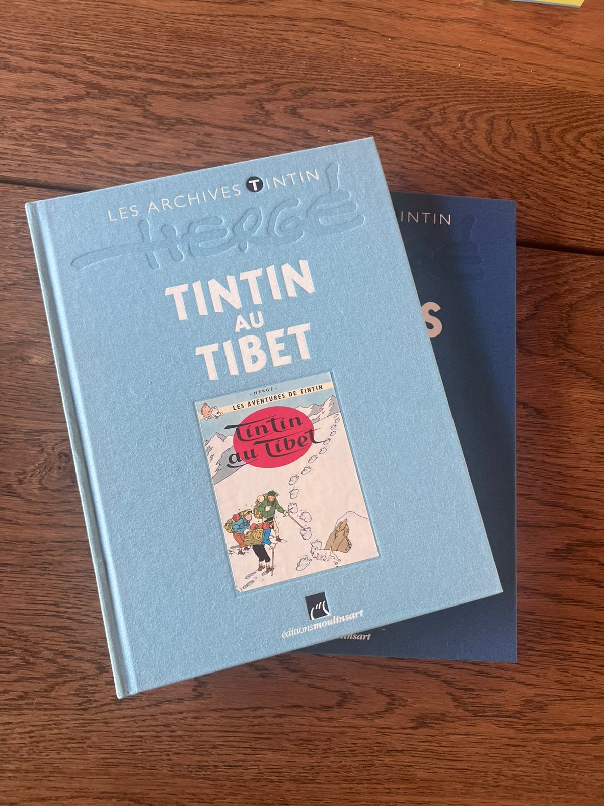 Lot de deux livre tintin au tibet et tintin le lotus bleu, Enlèvement ou Envoi, Tintin, Comme neuf, Livre ou Jeu