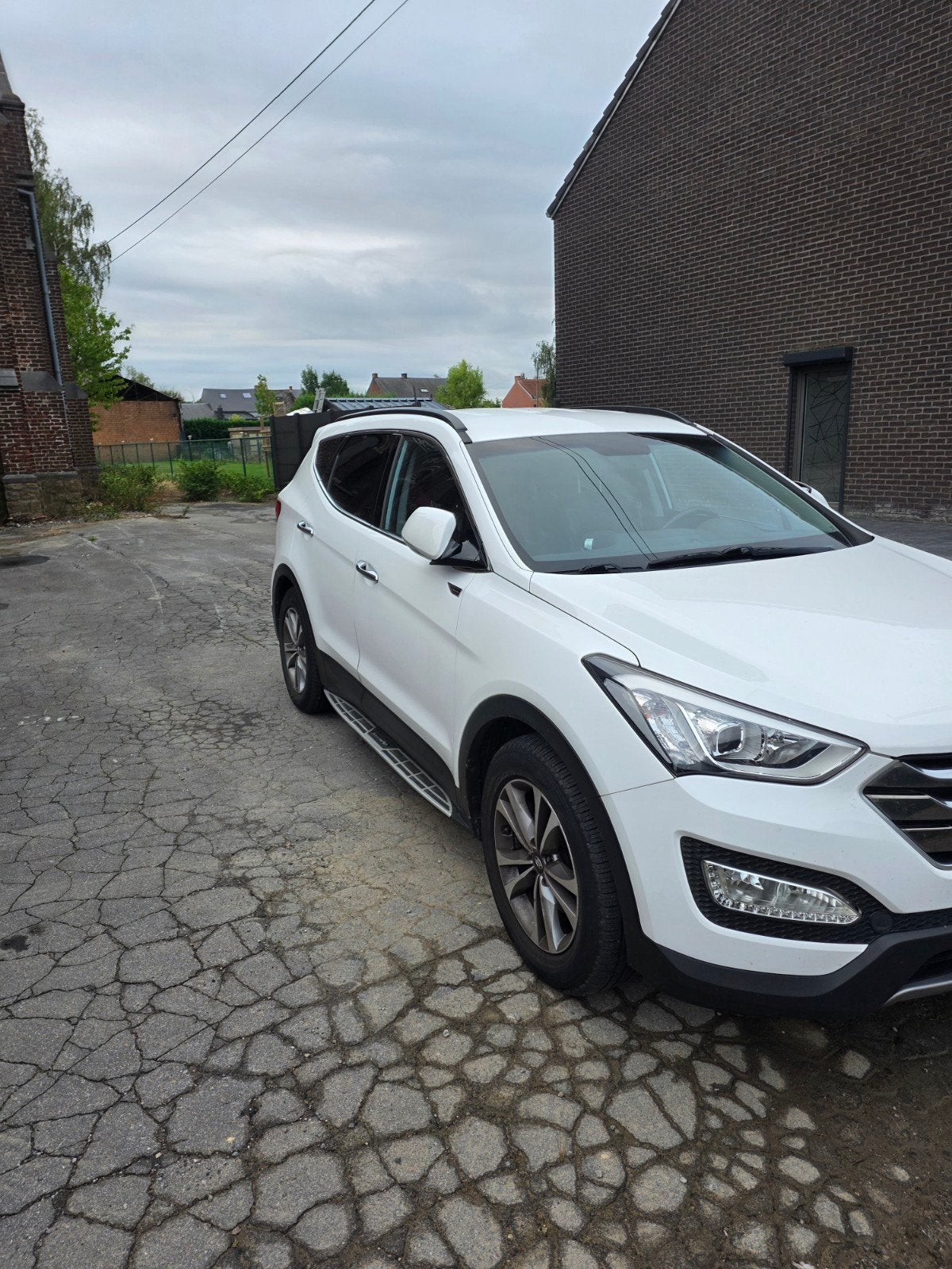 Hyundai Santa Fe uit 2015, Auto's, Santa Fe, 110 kW, Wit, Leder