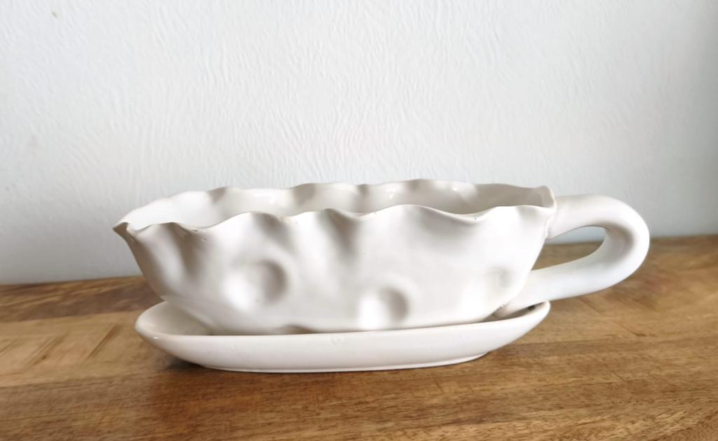 Witte keramische bloempot, Ophalen