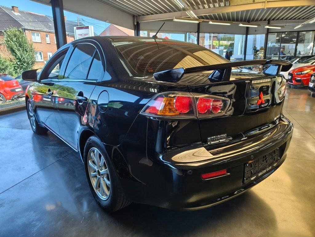 LANCER 1.6i SEDAN *SPOILER*SCHERM*CLIM*, Auto's, Voorwielaandrijving, 4 deurs, Stof, 4 cilinders