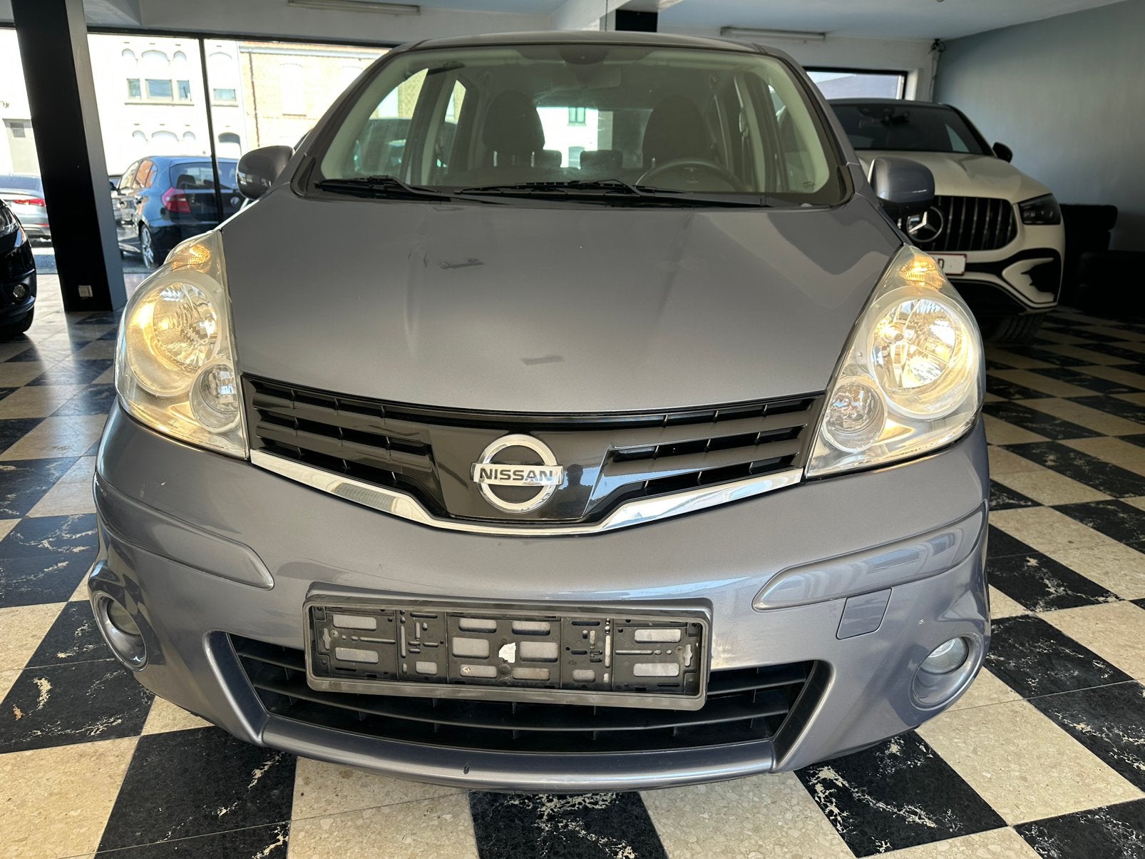 Nissan Note 1.4i | Navigatie | Airco | Parkeersensoren, Auto's, Nissan, Voorwielaandrijving, Stof, 139 g/km, Zwart