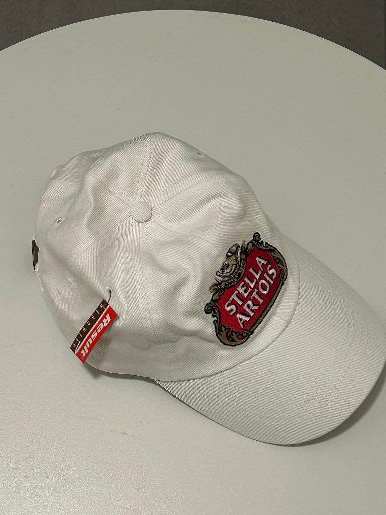 Stella Artois Pet in het Wit, Verzamelen, Biermerken, Ophalen of Verzenden, Nieuw, Kleding, Stella Artois