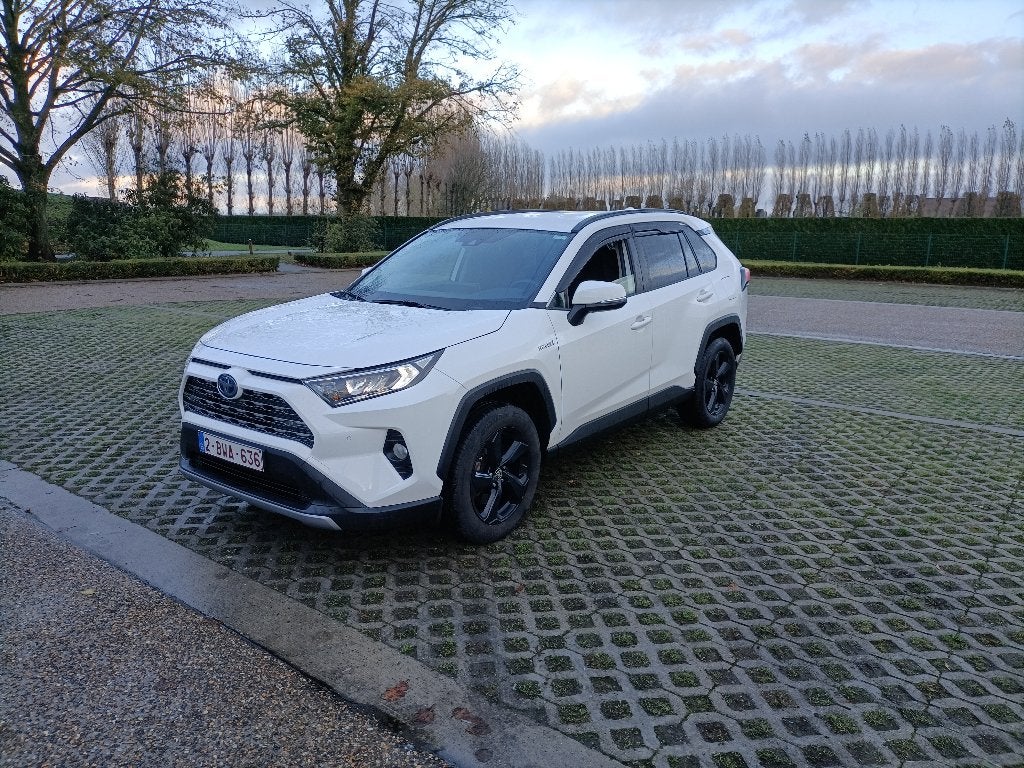 Toyota Rav 4 Benzien Hybrd garantie tot 2030. 78000 km, Auto's, Automaat, Dealer onderhouden, Stof, Wit