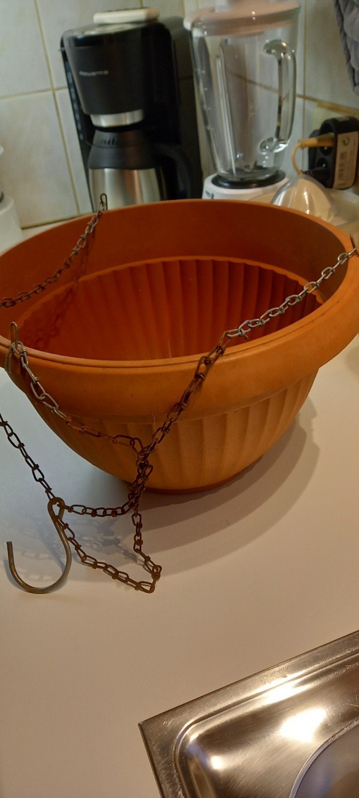 Hangmand voor bloemen, Ophalen