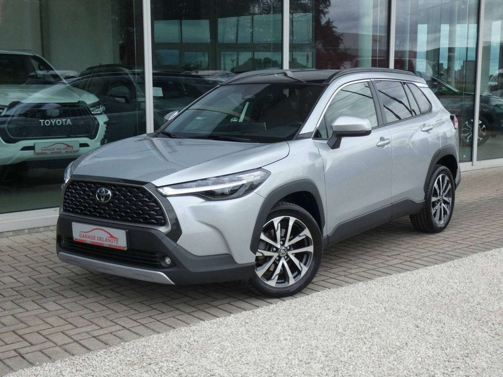 Toyota Corolla Cross 1.8 Hybrid 140pk STYLE+COMFORT PACK +Tr, Stof, Gebruikt, Zwart, 4 cilinders