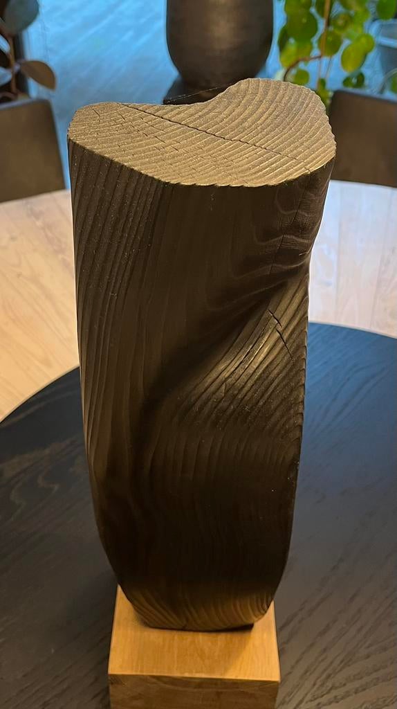 Vol houten sculptuur, Ophalen