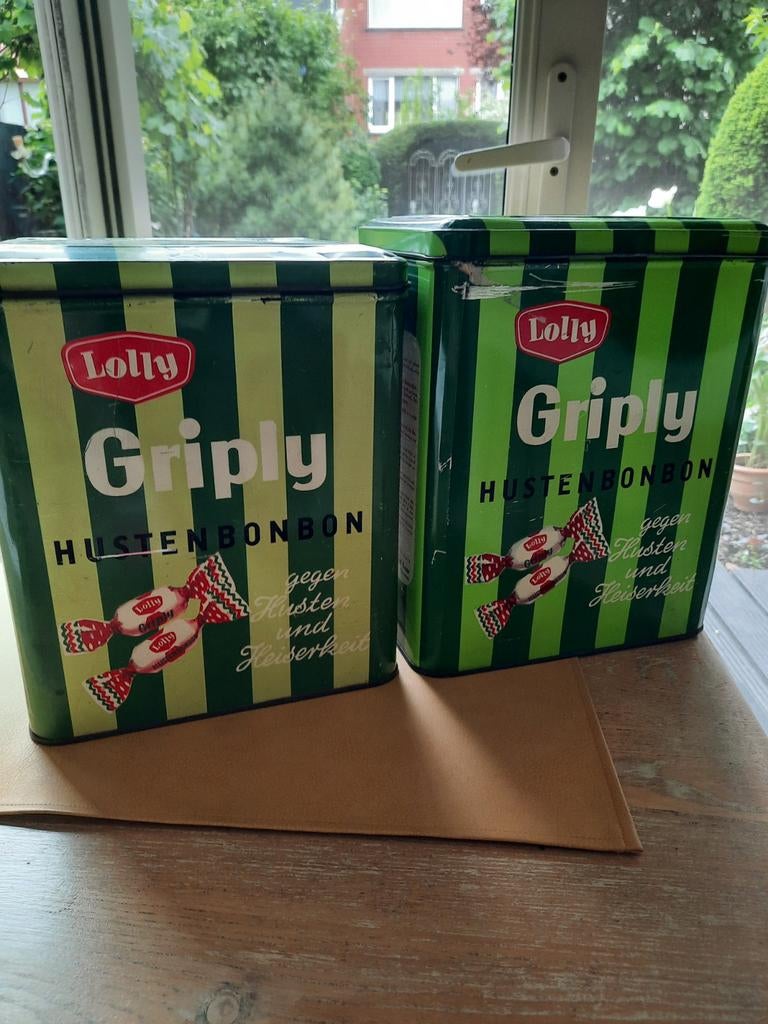 Oude blikken dozen van lolly, Enlèvement