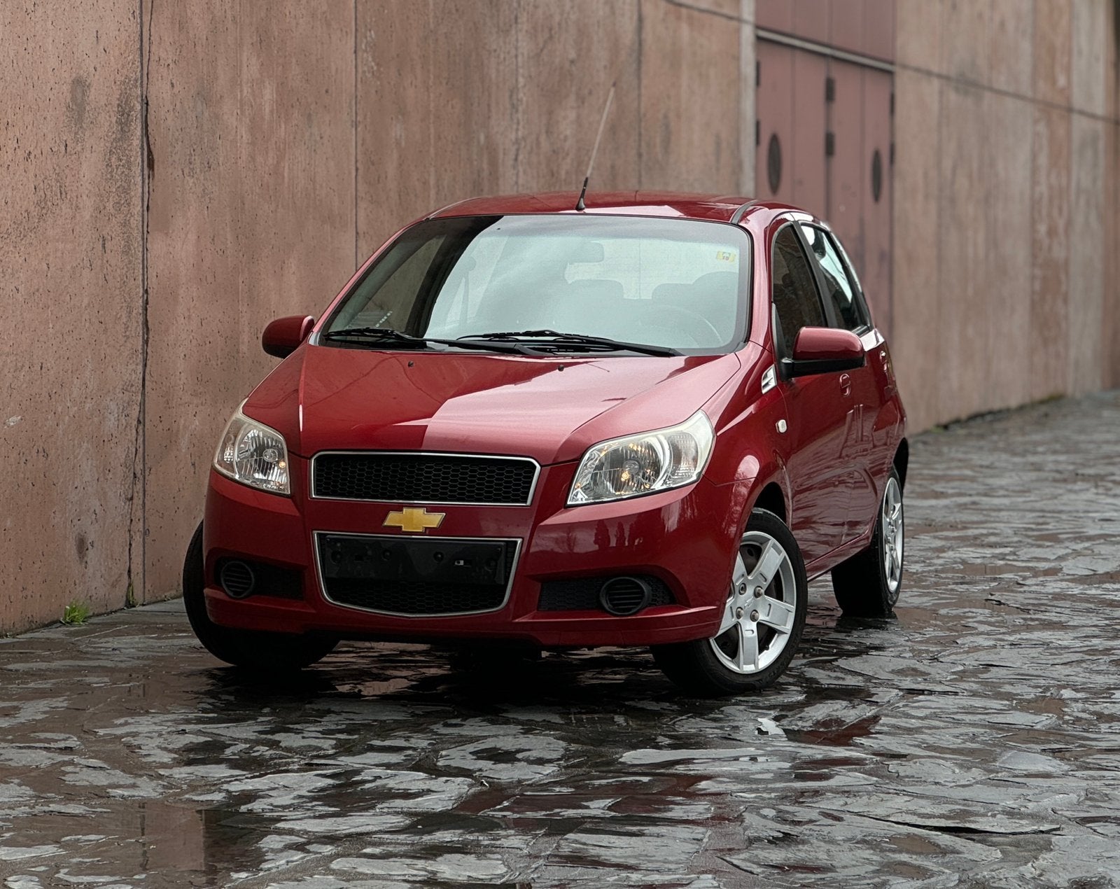Chevrolet Aveo 1.2i LS Zéér goede staat!, Autos, Rouge, Achat, Boîte manuelle, Noir