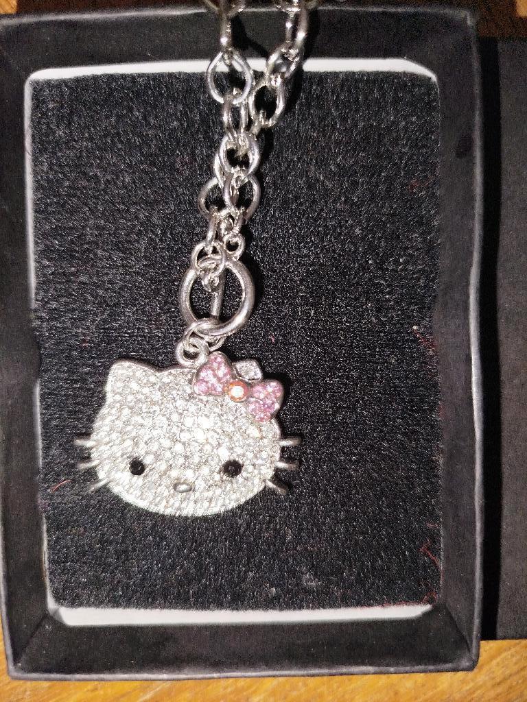 Nieuwe halsketting van Hello Kitty en de originele doos, Handtassen en Accessoires, Overige materialen, Met hanger, Nieuw, Ophalen of Verzenden