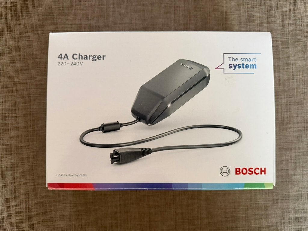 Bosch e--bike oplader 4A, Fietsen en Brommers, Zo goed als nieuw