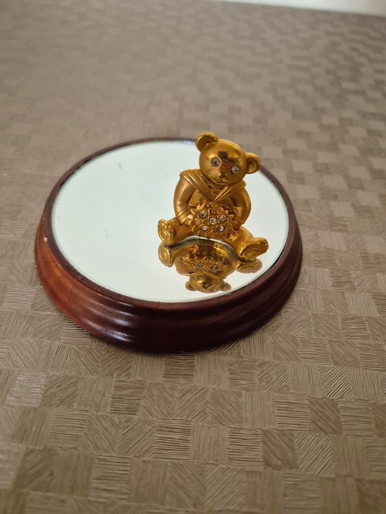 Vintage onderzetter met spiegel en goudkleurige beer erop, Huis en Inrichting, Woonaccessoires | Onderzetters, Ophalen of Verzenden
