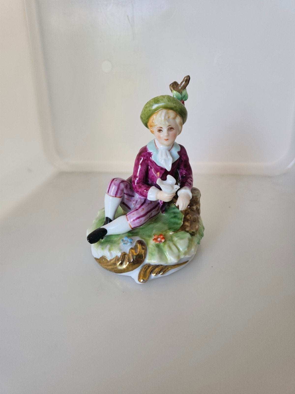 Beeldje porselein kind duif, Ophalen
