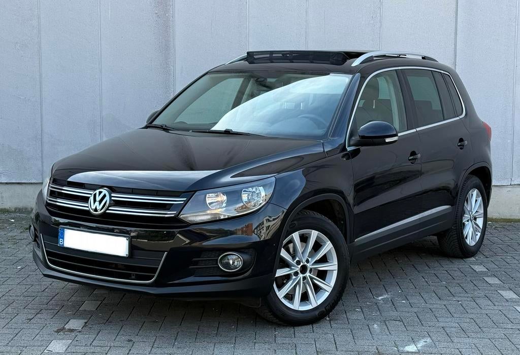 Volkswagen TIGUAN 1.4 TSI PANO DAK/AUTO VERSNELLINGSBAK, Auto's, Monovolume, Zwart, Leder, 5 zetels