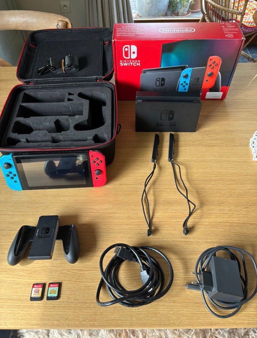 Nitendo switch + case + 2 games ( 1 speciale), Comme neuf, Enlèvement, Switch Original, Avec jeux
