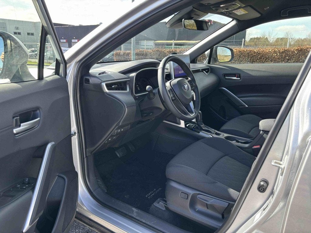 Toyota Corolla Cross 1.8 Hybrid Comfort | Achteruitrijcamera, Auto's, Stof, Gebruikt, 4 cilinders, 2 kWh